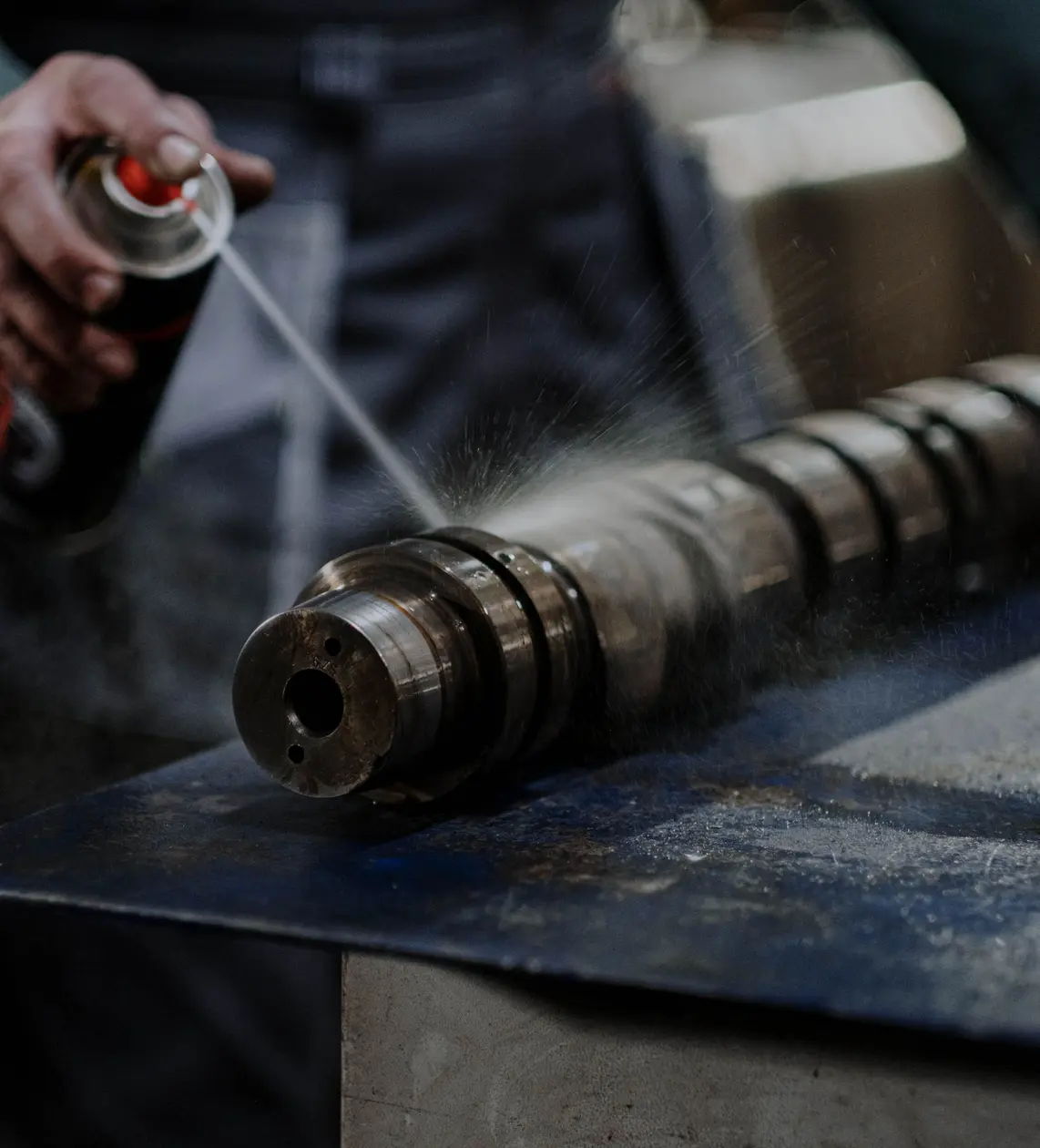 Industrial cleaning process using specialty chemical solvents to remove oils and contaminants from metal parts